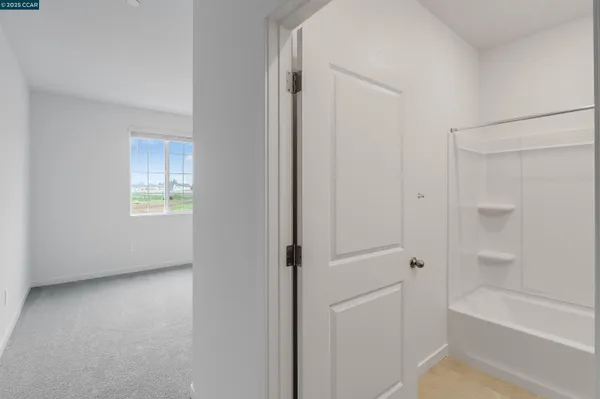 a view of an empty room and closet