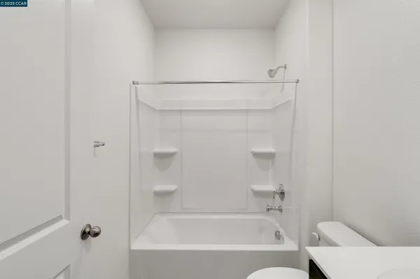 an empty room with a empty space and windows