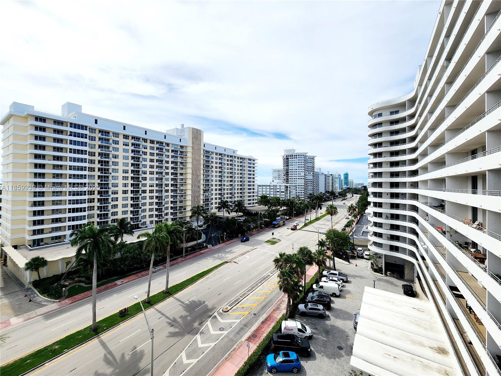 5555 Collins Avenue, Unit 9S Miami Beach, FL 33140 - Photo 15 of 48 a view of balcony with seating space and potted plants