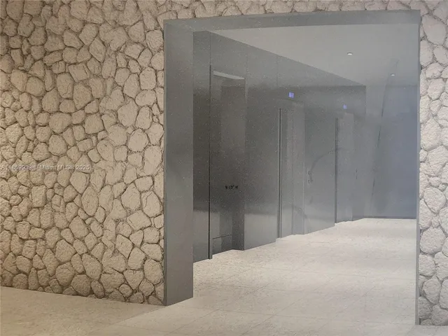 a bedroom with a bed and a chair