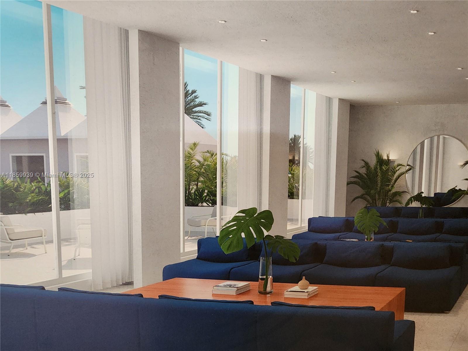 5555 Collins Avenue, Unit 9S Miami Beach, FL 33140 - Photo 21 of 48 a living room with furniture potted plant and a window