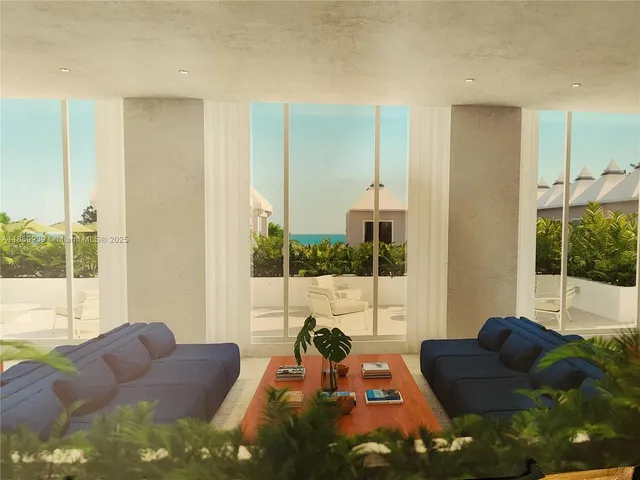 a living room with furniture and a floor to ceiling window