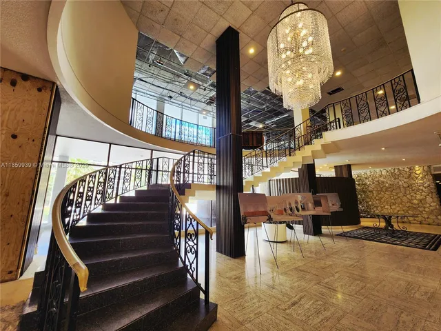 a view of entryway and hall with dining room