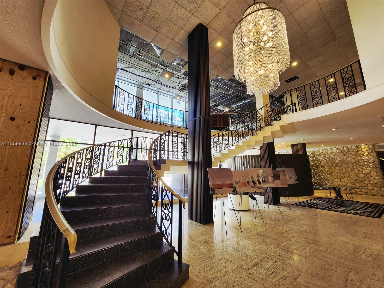 5555 Collins Avenue, Unit 9S Miami Beach, FL 33140 - Photo 28 of 48 a view of entryway and hall with dining room