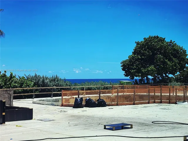 a view of a swimming pool with a lounge chair