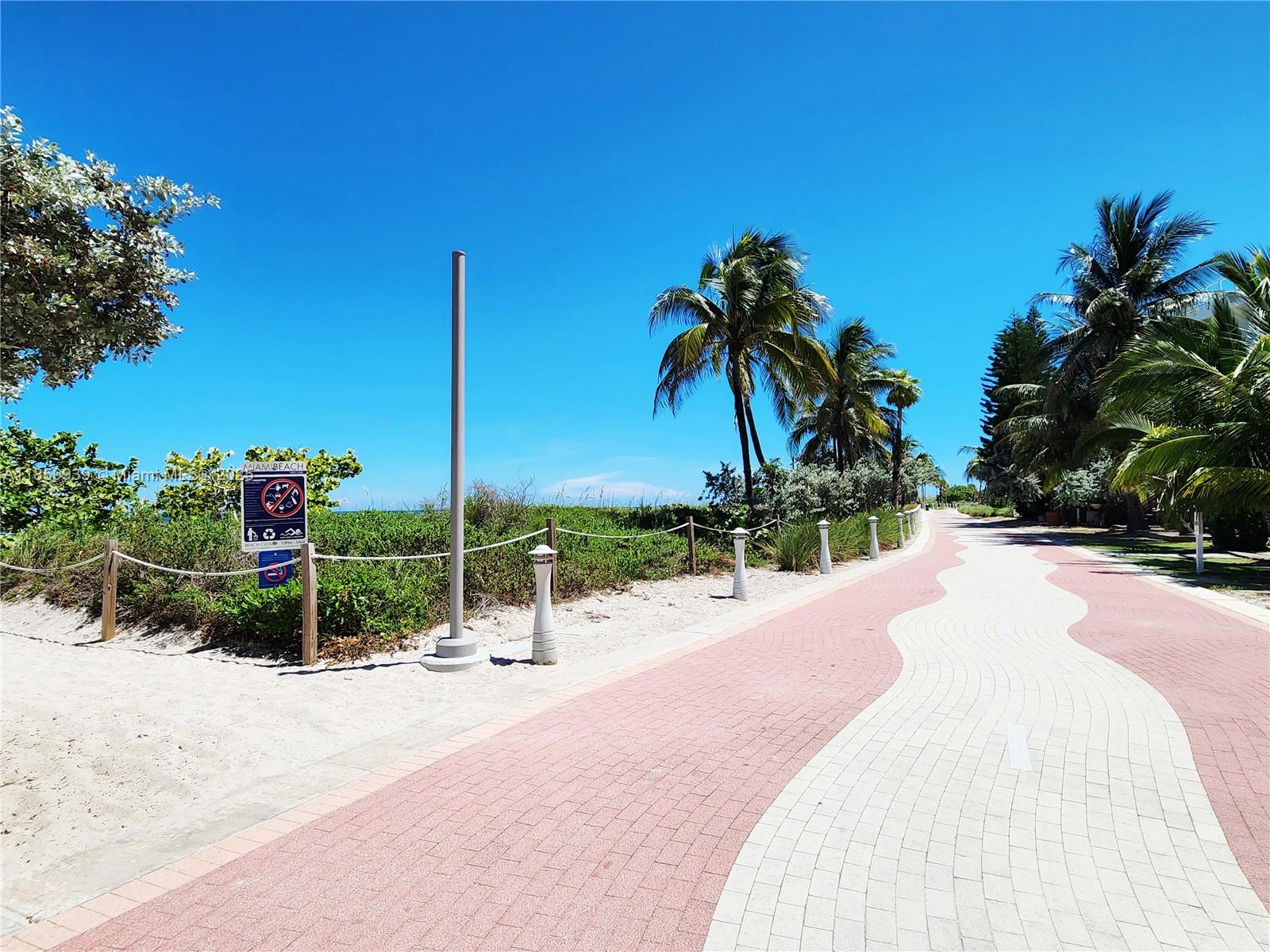 5555 Collins Avenue, Unit 9S Miami Beach, FL 33140 - Photo 34 of 48 a park view with a garden space