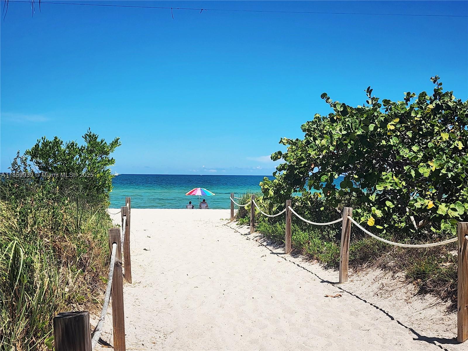 5555 Collins Avenue, Unit 9S Miami Beach, FL 33140 - Photo 35 of 48 a backyard of a house with lots of green space