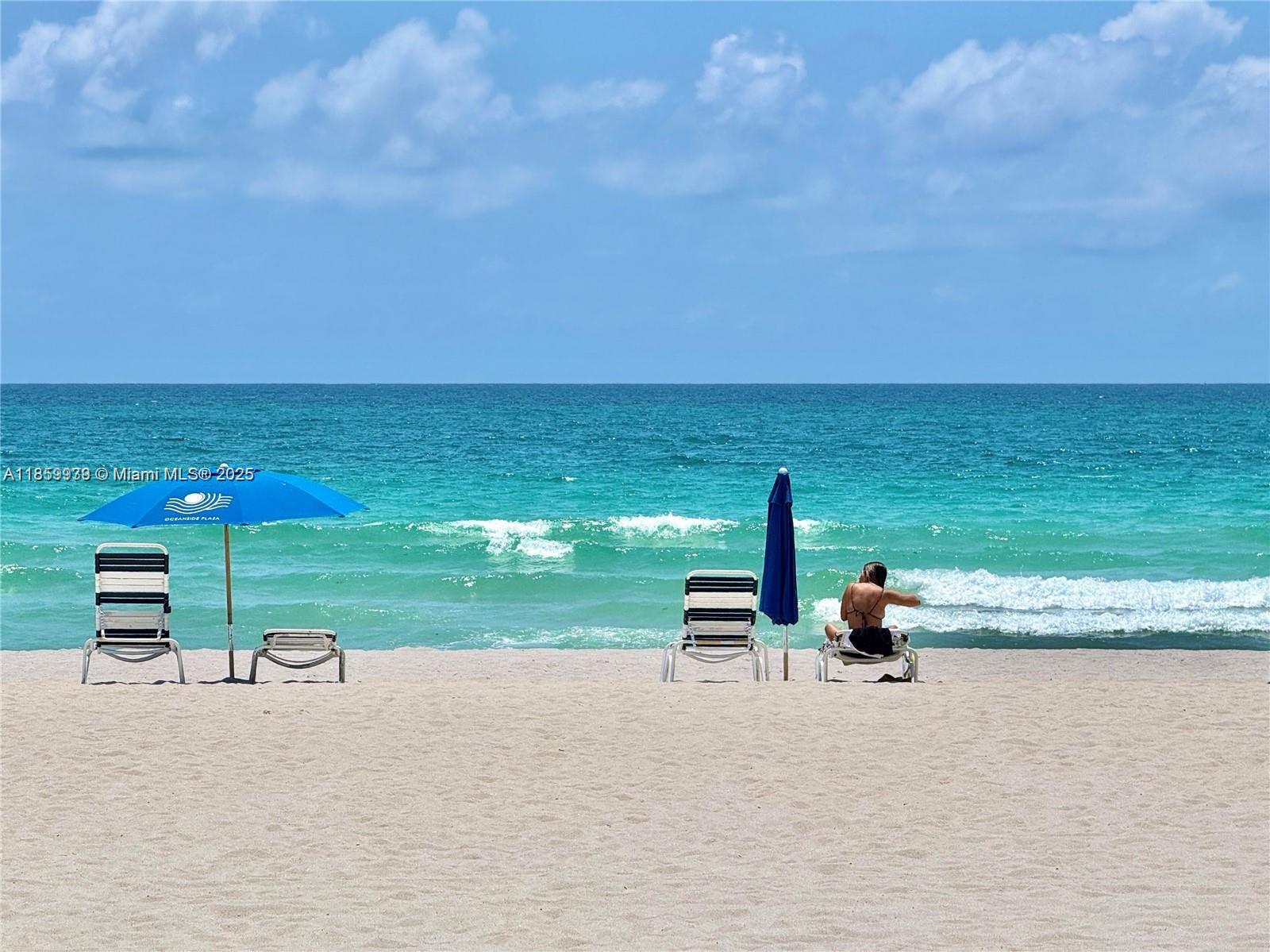 5555 Collins Avenue, Unit 9S Miami Beach, FL 33140 - Photo 45 of 48 a view of a lake with sitting area