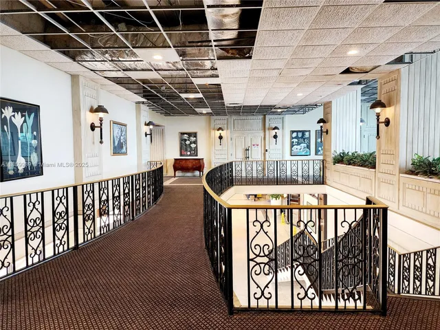 a view of entryway with a couches and wooden floor