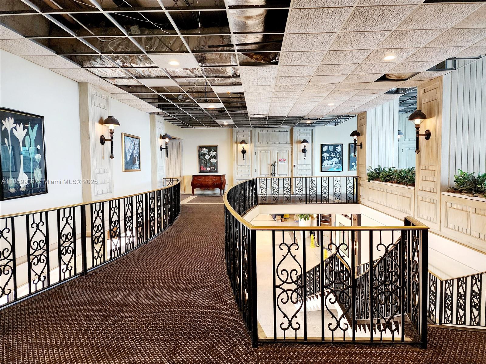 5555 Collins Avenue, Unit 9S Miami Beach, FL 33140 - Photo 6 of 48 a view of entryway with a couches and wooden floor