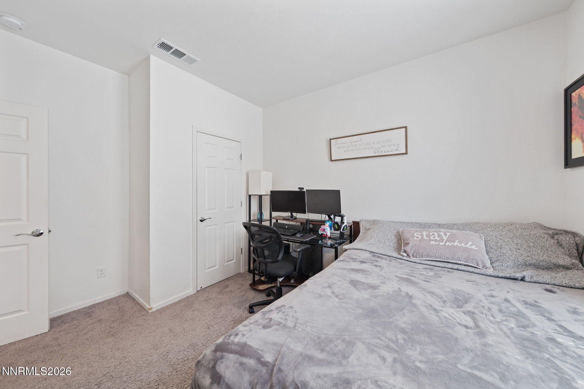 9708 Sea Glass Drive Reno, NV 89506 - Photo 6 of 51 a bedroom with a bed and furniture