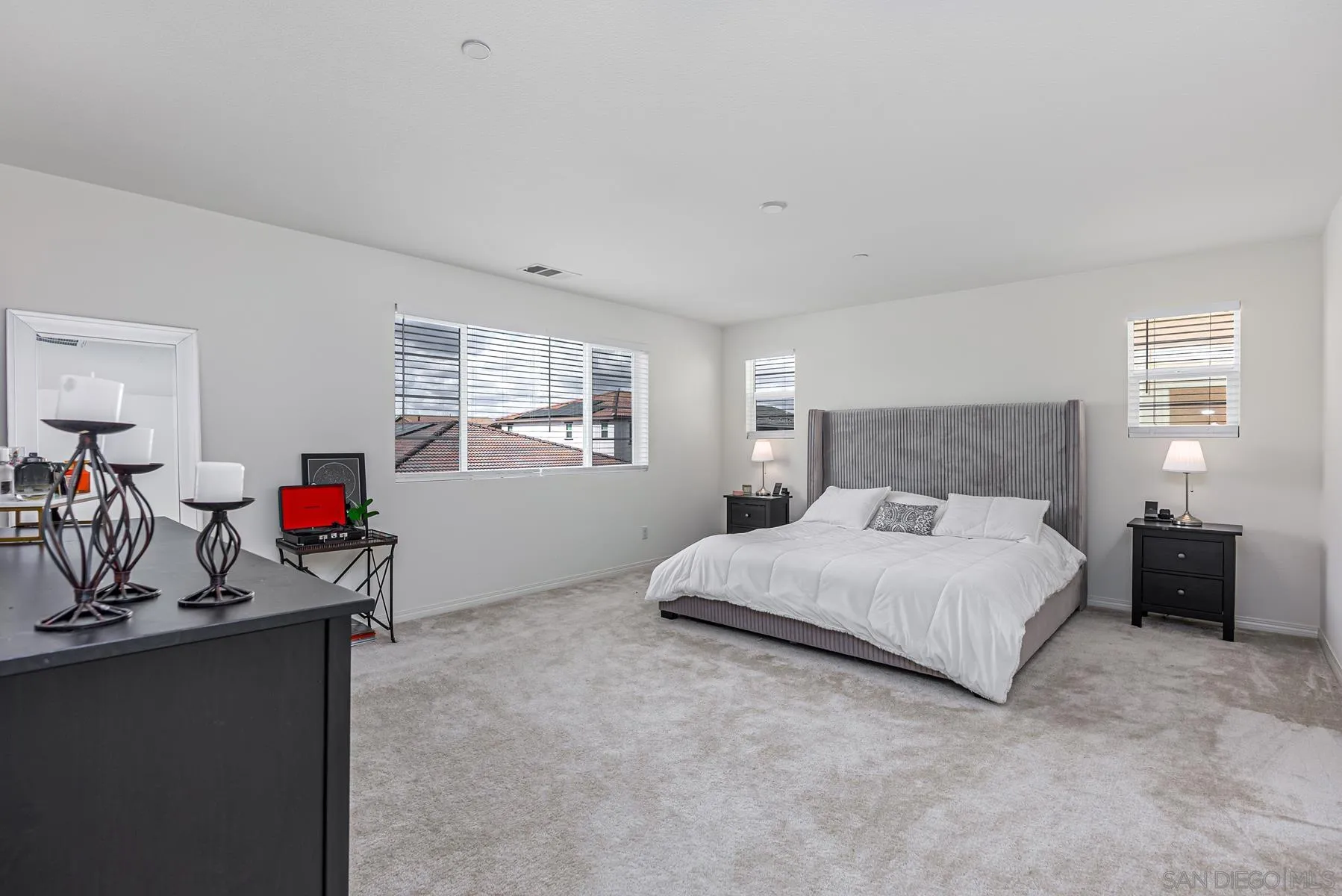 30903 Wild Berry Way Menifee, CA 92584 - Photo 14 of 37 a bedroom with a bed and a dresser