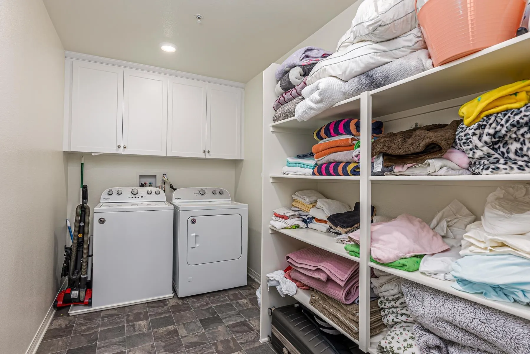 30903 Wild Berry Way Menifee, CA 92584 - Photo 18 of 37 a storage room with washer and dryer