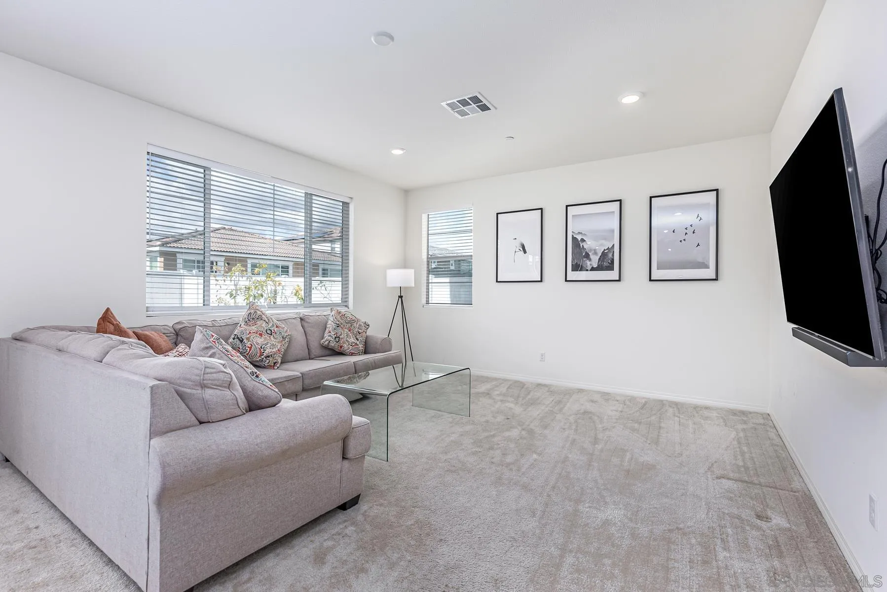 30903 Wild Berry Way Menifee, CA 92584 - Photo 2 of 37 a living room with furniture and a flat screen tv