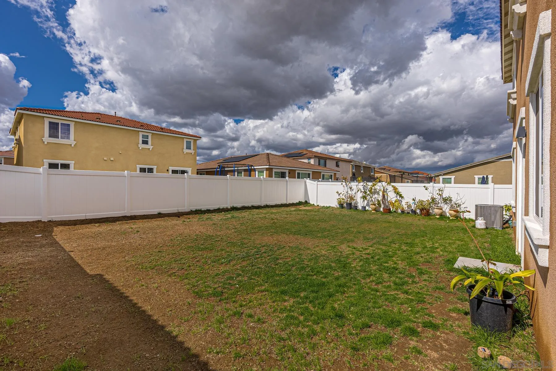30903 Wild Berry Way Menifee, CA 92584 - Photo 29 of 37 a front view of a house with a garden