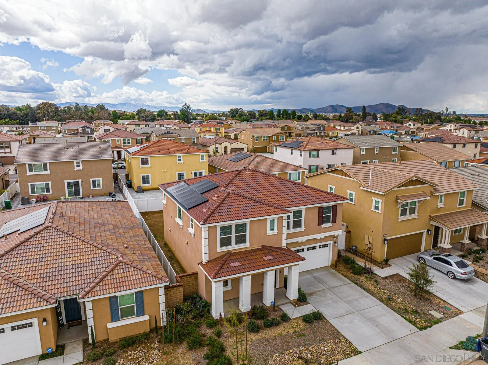 30903 Wild Berry Way Menifee, CA 92584 - Photo 30 of 37 an aerial view of a residential apartment building with a yard