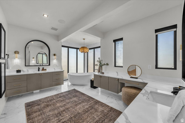 2152 South 30 West Orem, UT 84058 - Photo 49 of 56 Full bath featuring two vanities and a freestanding tub
