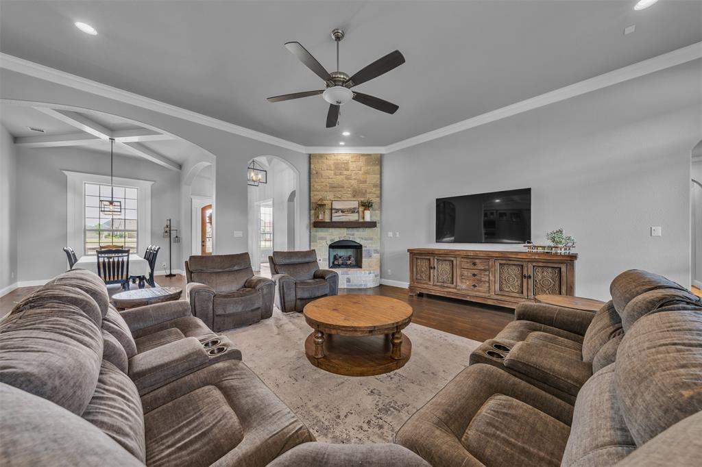 1060 Waters Edge Court Oak Point, TX 75068 - Photo 8 of 40 a living room with furniture and a flat screen tv