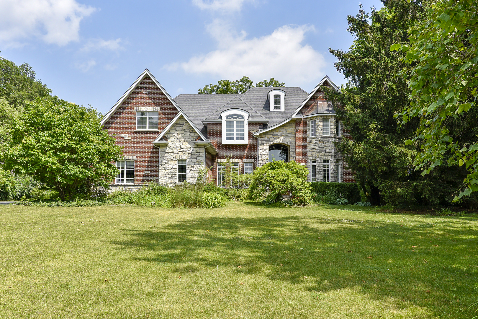 111 Haman Road Inverness, IL 60067 - Photo 1 of 19 a front view of a house with a yard