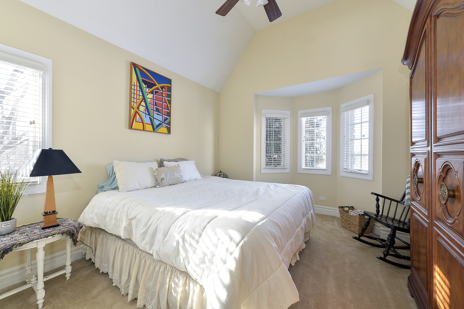 111 Haman Road Inverness, IL 60067 - Photo 13 of 19 a bedroom with a bed and a chandelier