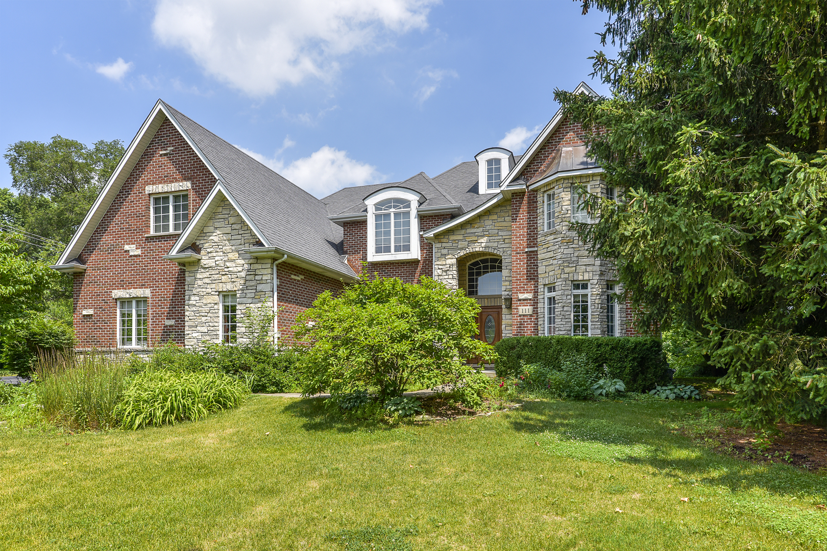 111 Haman Road Inverness, IL 60067 - Photo 19 of 19 a front view of a house with a yard