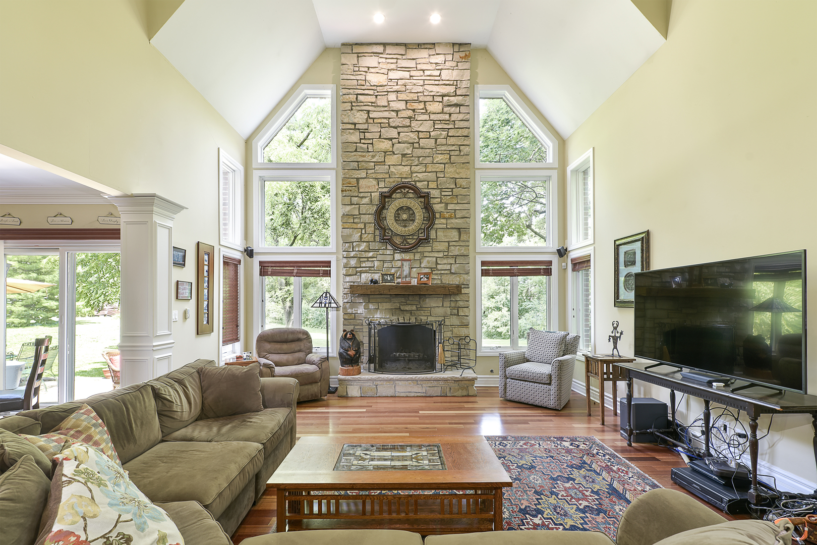 111 Haman Road Inverness, IL 60067 - Photo 3 of 19 a living room with furniture a flat screen tv and a fireplace