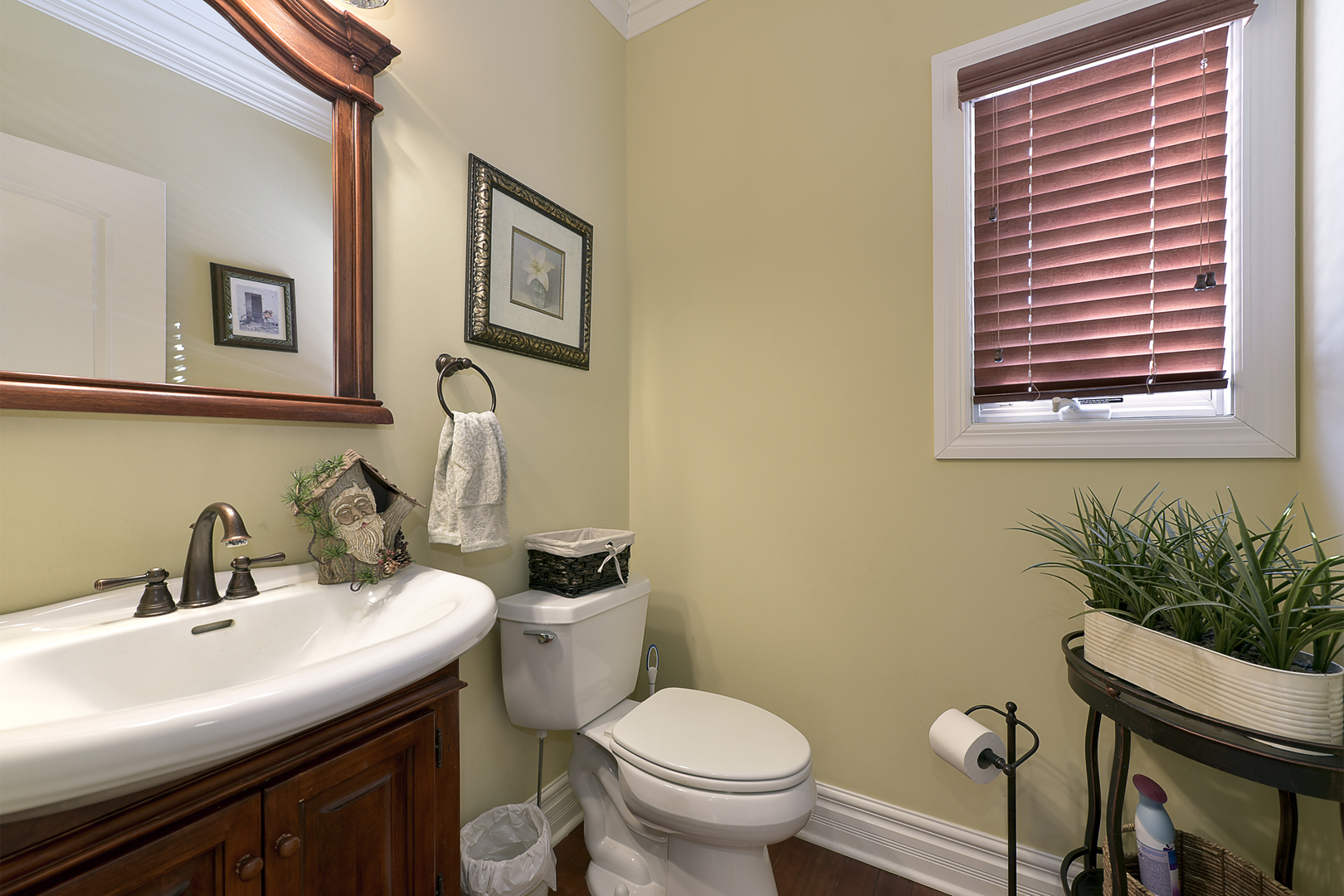 111 Haman Road Inverness, IL 60067 - Photo 9 of 19 a bathroom with a toilet a sink and mirror