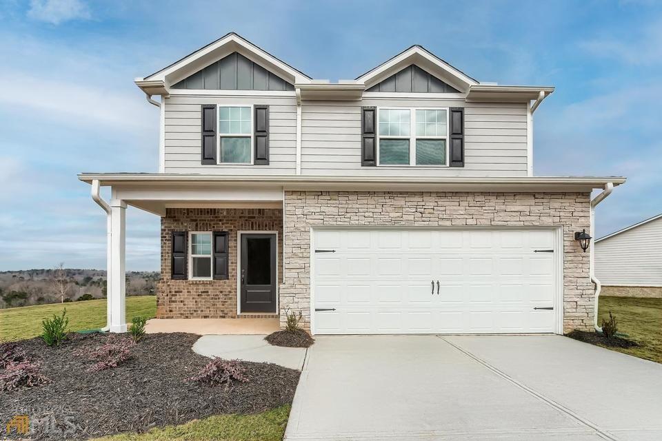 986 Minden Terrace Fairburn, GA 30213 - Photo 1 of 1 a front view of a house with a yard and garage