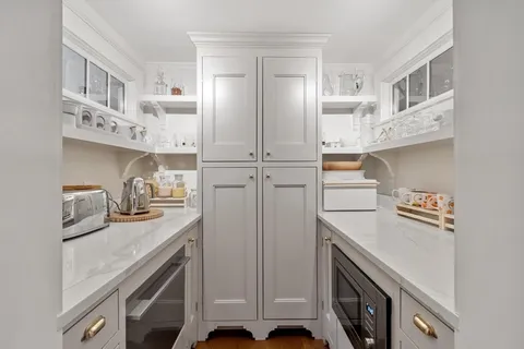a kitchen with cabinets and appliances
