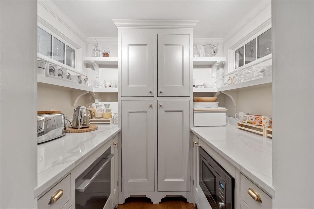 653 Main Street Concord, MA 01742 - Photo 14 of 42 a kitchen with cabinets and appliances