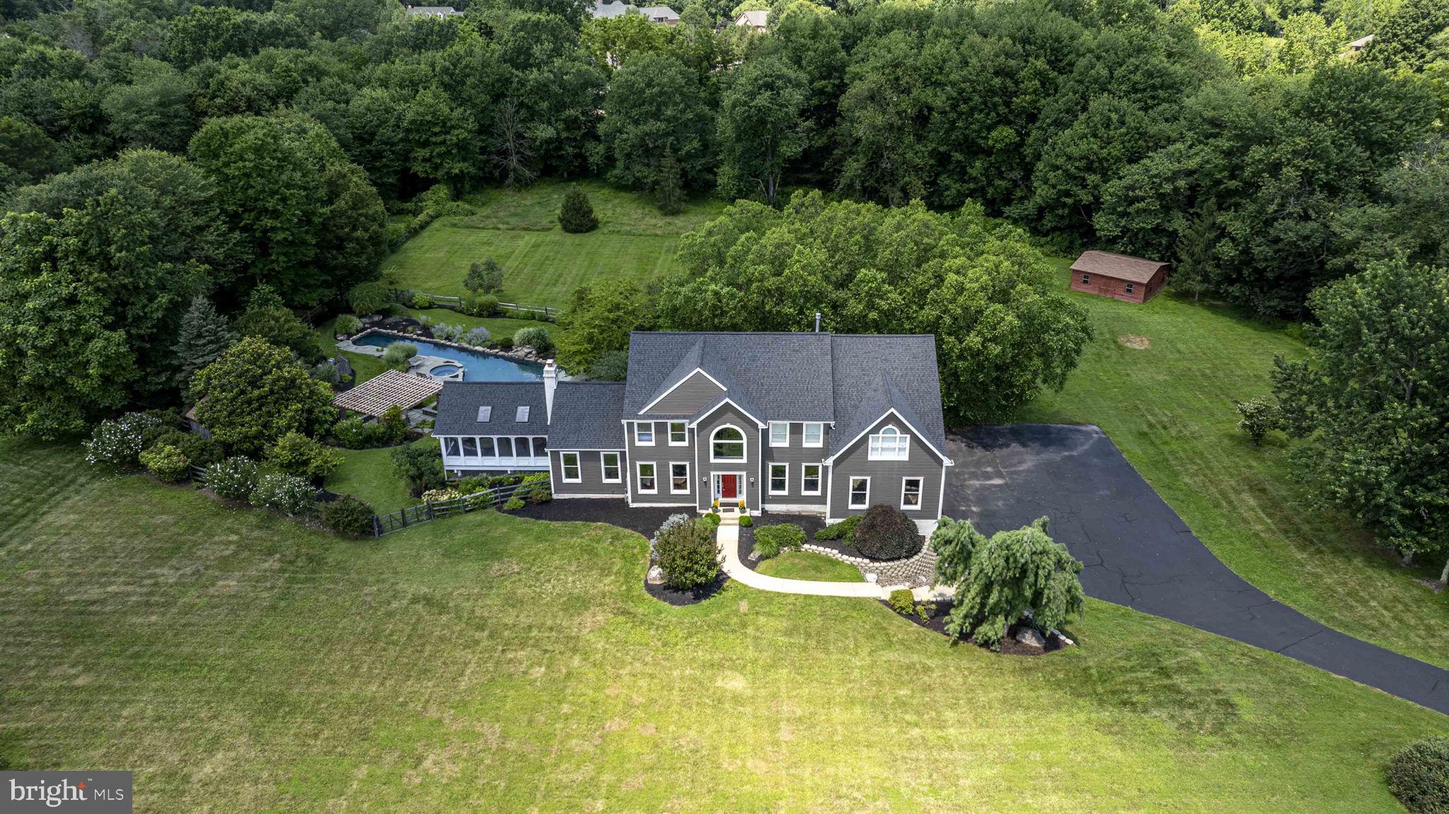 340 West Sandy Ridge Road Doylestown, PA 18901 - Photo 1 of 40 an aerial view of a house with swimming pool and garden