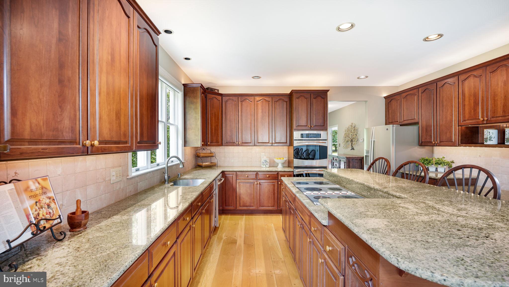 340 West Sandy Ridge Road Doylestown, PA 18901 - Photo 11 of 40 a kitchen with a refrigerator a sink and wooden cabinets