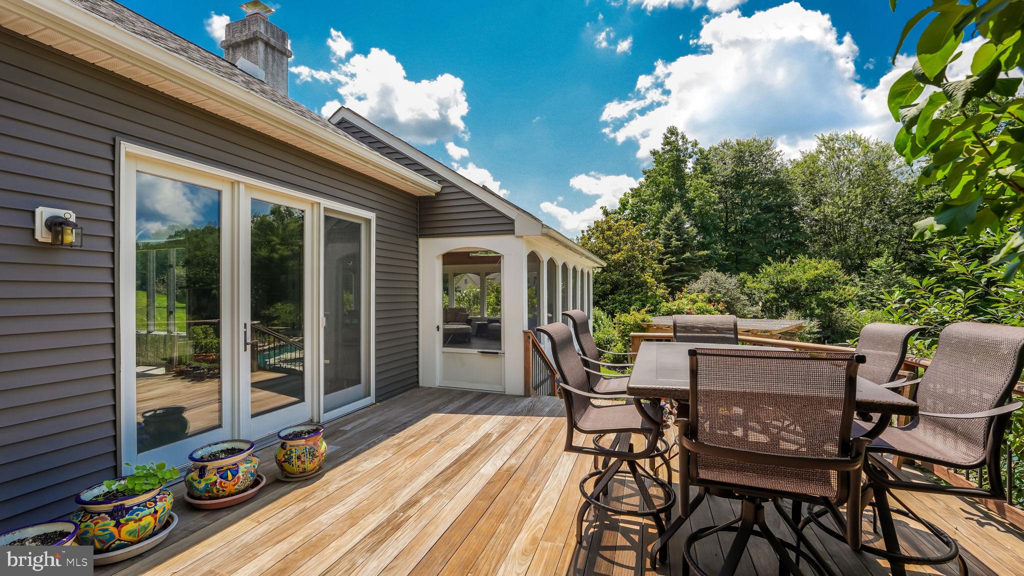 340 West Sandy Ridge Road Doylestown, PA 18901 - Photo 31 of 40 a view of a patio with table and chairs and potted plants