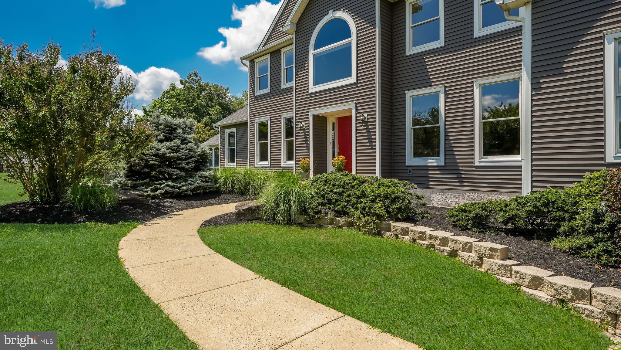 340 West Sandy Ridge Road Doylestown, PA 18901 - Photo 4 of 40 a front view of a house with a yard