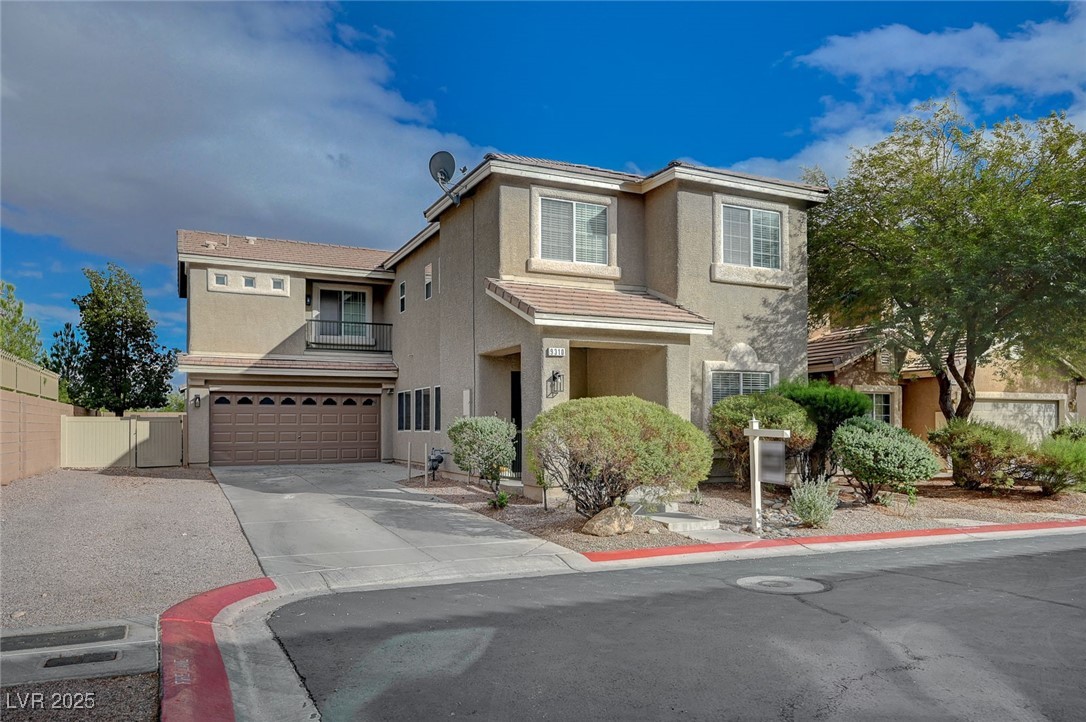 9310 Pinarello Street Las Vegas, NV 89178 - Photo 1 of 61 Traditional-style home featuring stucco siding, concrete driveway, an attached garage, and a tiled roof