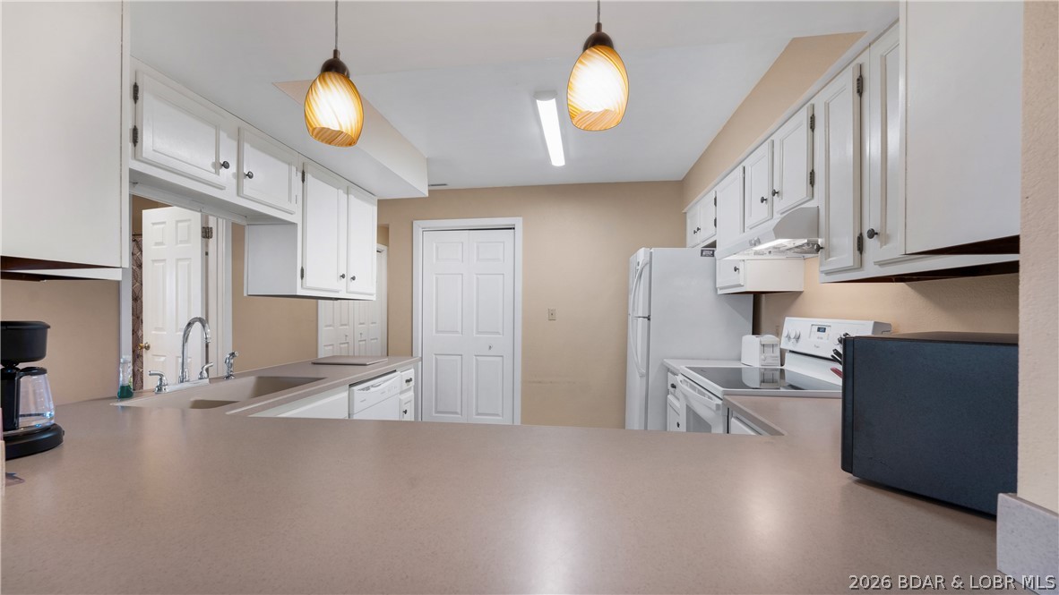 5940 Baydy Peak Road, Unit 123 Osage Beach, MO 65065 - Photo 8 of 43 Corian countertops
