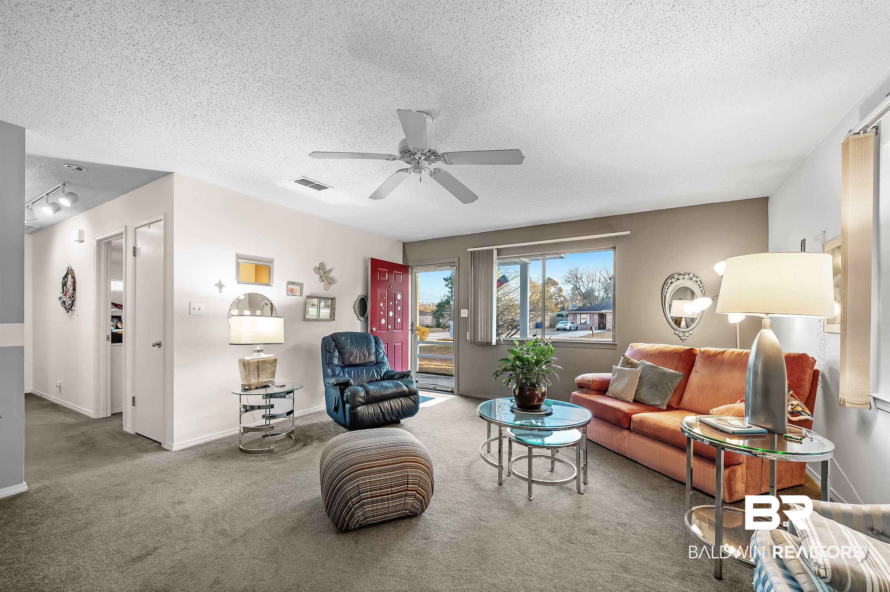 526 Ariel Avenue Foley, AL 36535 - Photo 8 of 33 Carpeted living room featuring ceiling fan and a textured ceiling
