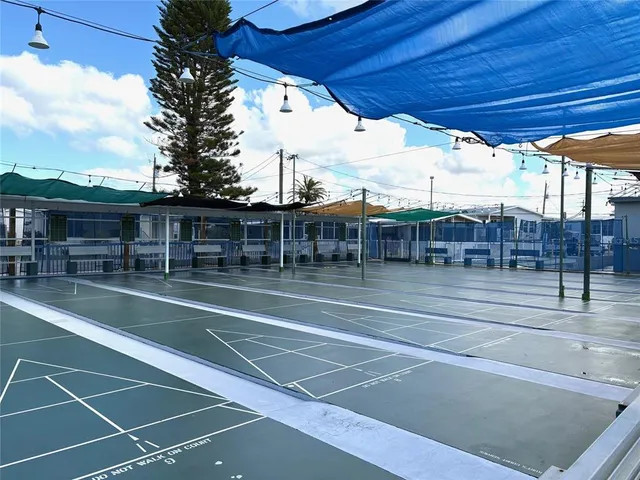 a view of a swimming pool with seating space