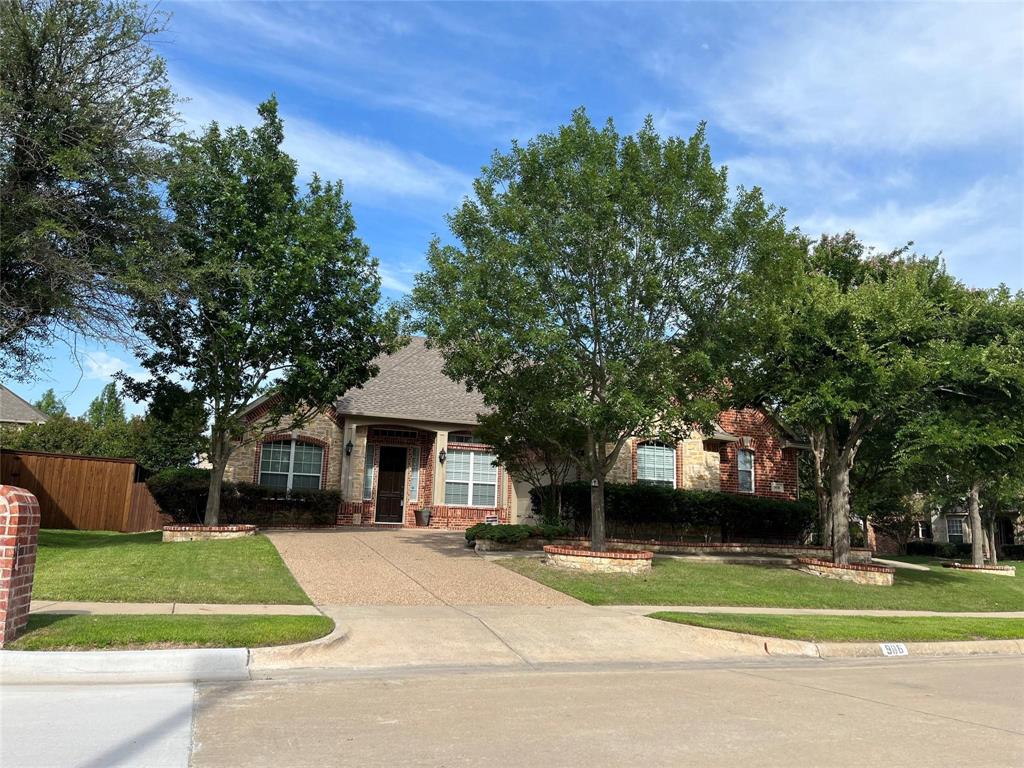 Obstructed view of property featuring brick siding