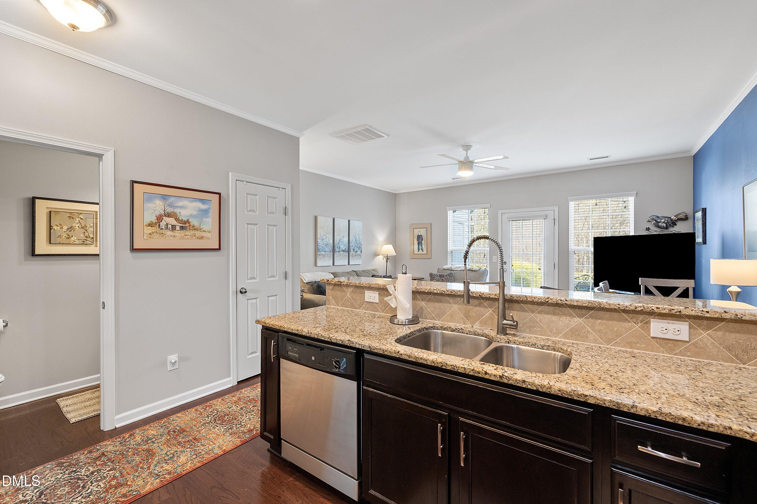 1093 Renewal Place Raleigh, NC 27603 - Photo 12 of 45 a kitchen with granite countertop a sink and a stove top oven