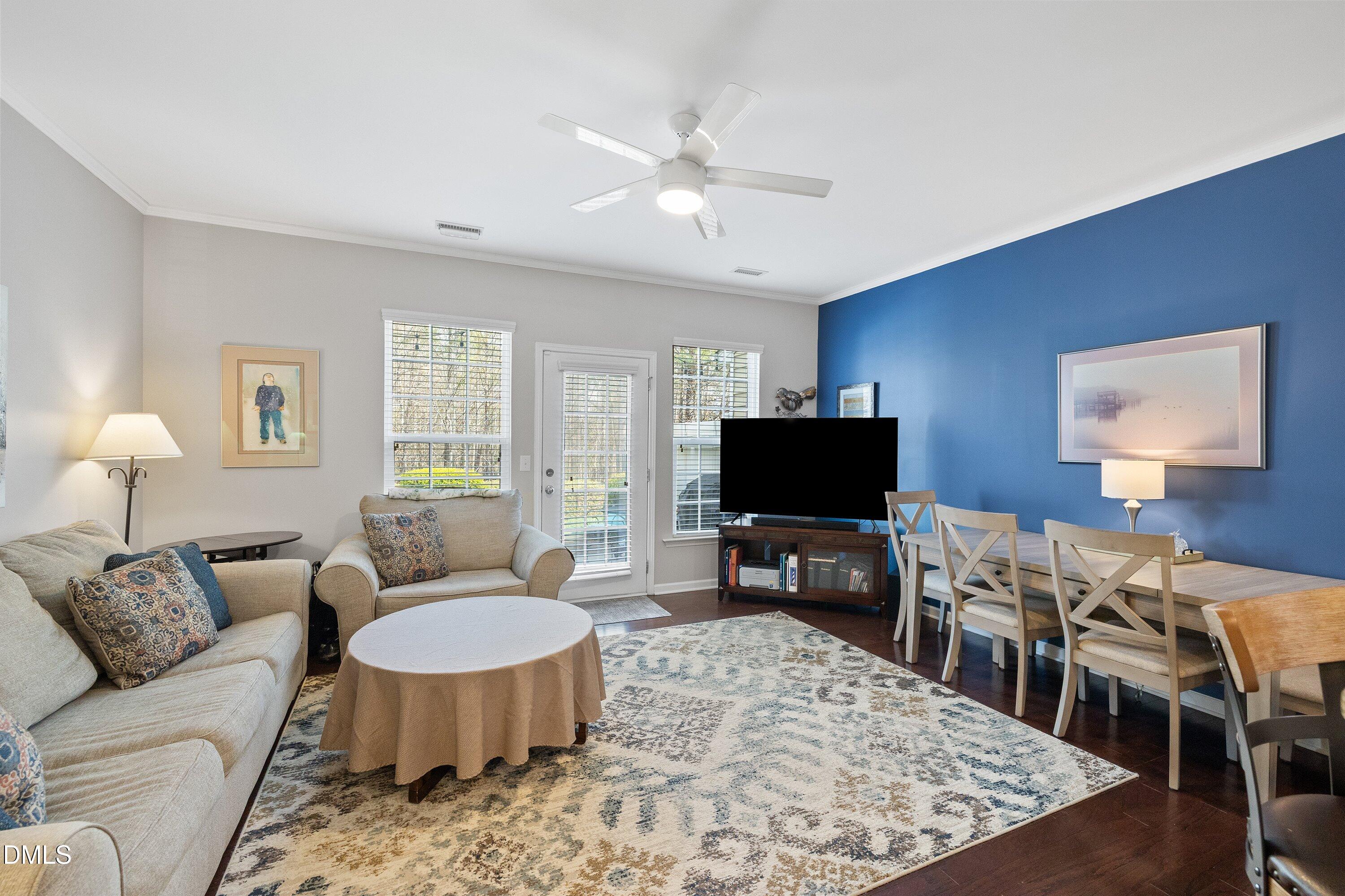 1093 Renewal Place Raleigh, NC 27603 - Photo 14 of 45 a living room with furniture and a flat screen tv