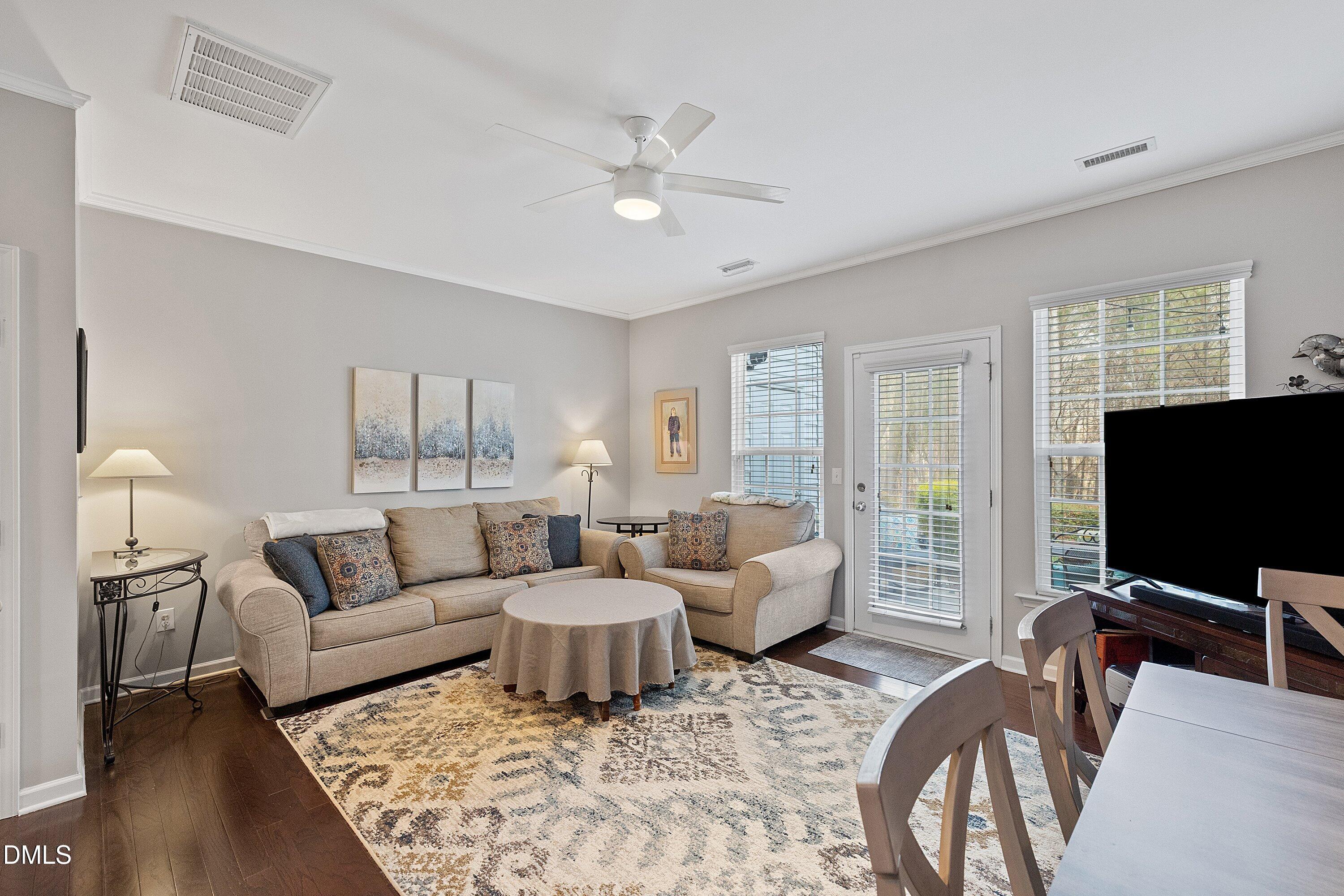 1093 Renewal Place Raleigh, NC 27603 - Photo 15 of 45 a living room with furniture and a flat screen tv