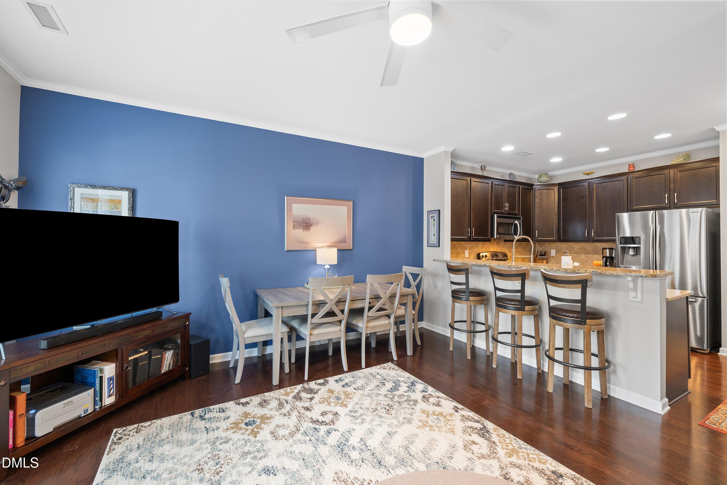 1093 Renewal Place Raleigh, NC 27603 - Photo 17 of 45 a living room with furniture and a flat screen tv