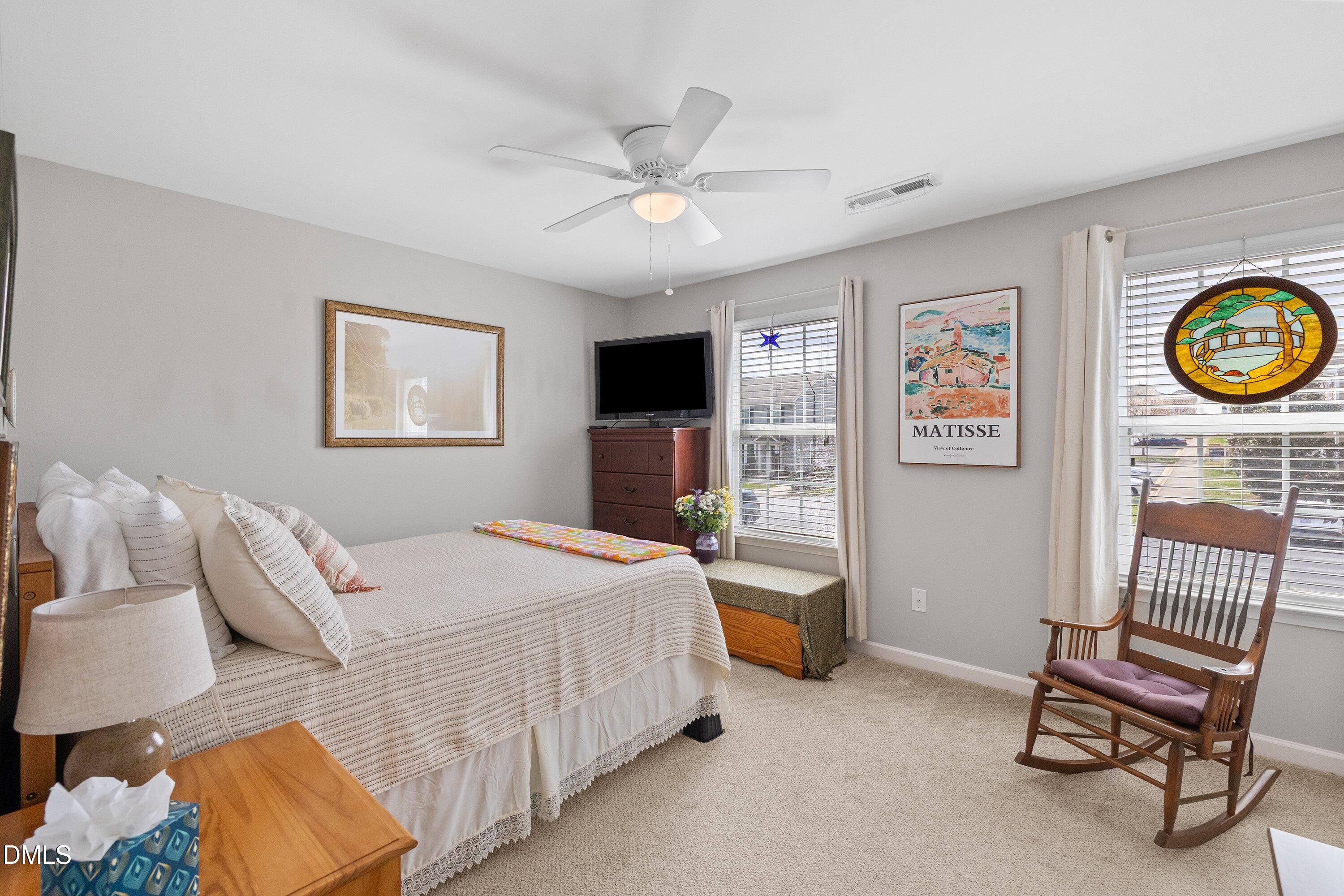1093 Renewal Place Raleigh, NC 27603 - Photo 19 of 45 a bedroom with a bed and a chair
