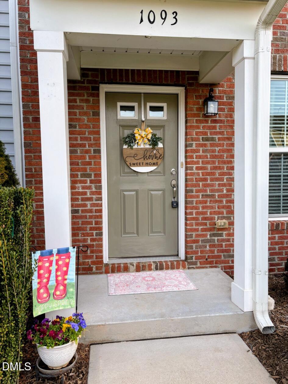 1093 Renewal Place Raleigh, NC 27603 - Photo 2 of 45 a front view of a house with pots