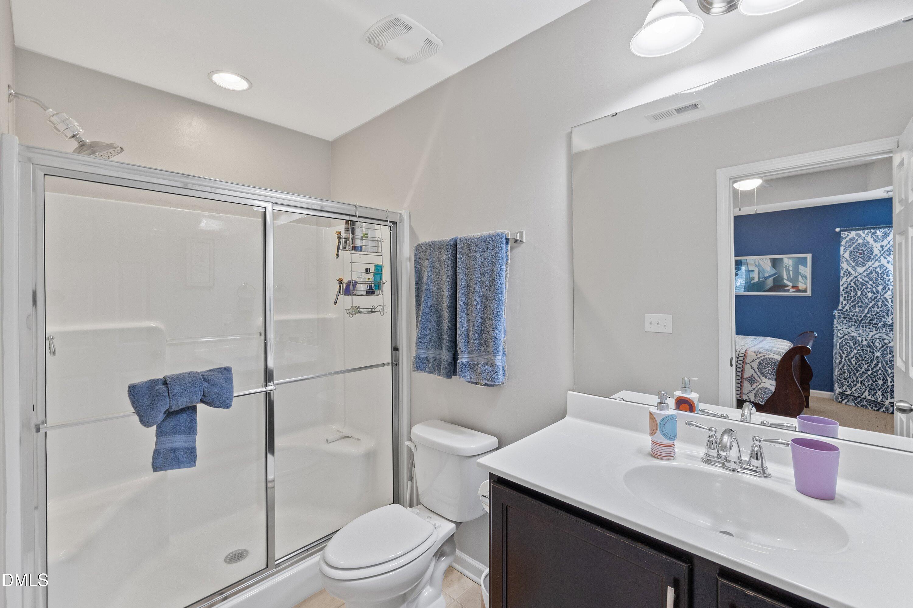 1093 Renewal Place Raleigh, NC 27603 - Photo 29 of 45 a bathroom with a sink toilet and shower
