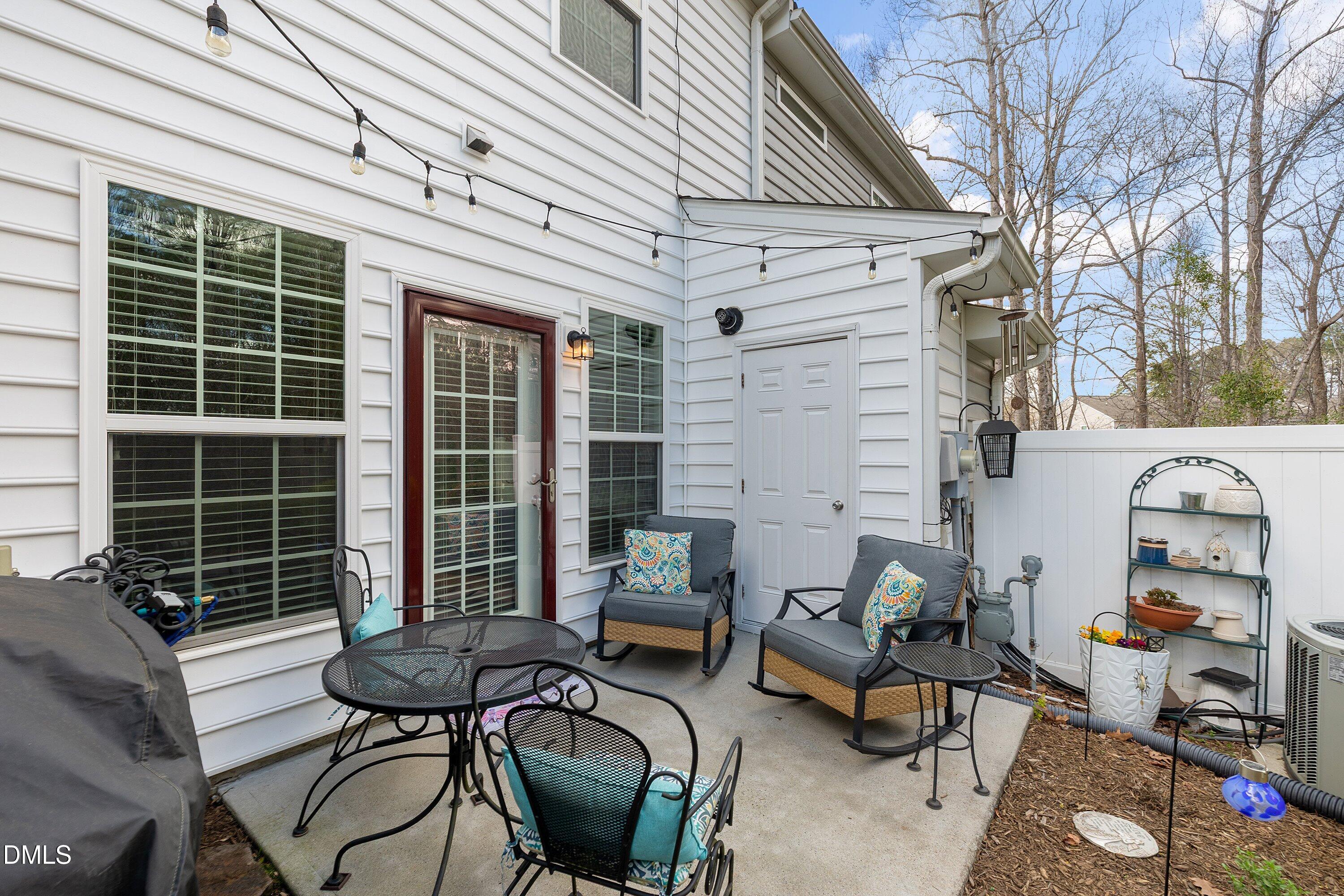 1093 Renewal Place Raleigh, NC 27603 - Photo 32 of 45 a backyard of a house with barbeque oven table and chairs