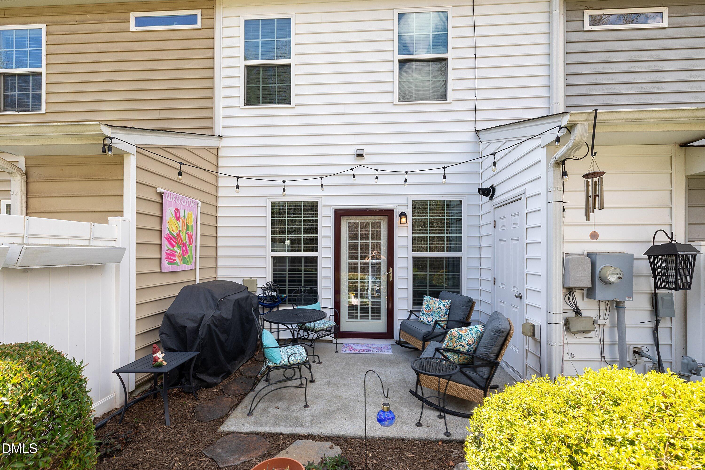 1093 Renewal Place Raleigh, NC 27603 - Photo 34 of 45 a view of a dinning tables and chairs in the patio