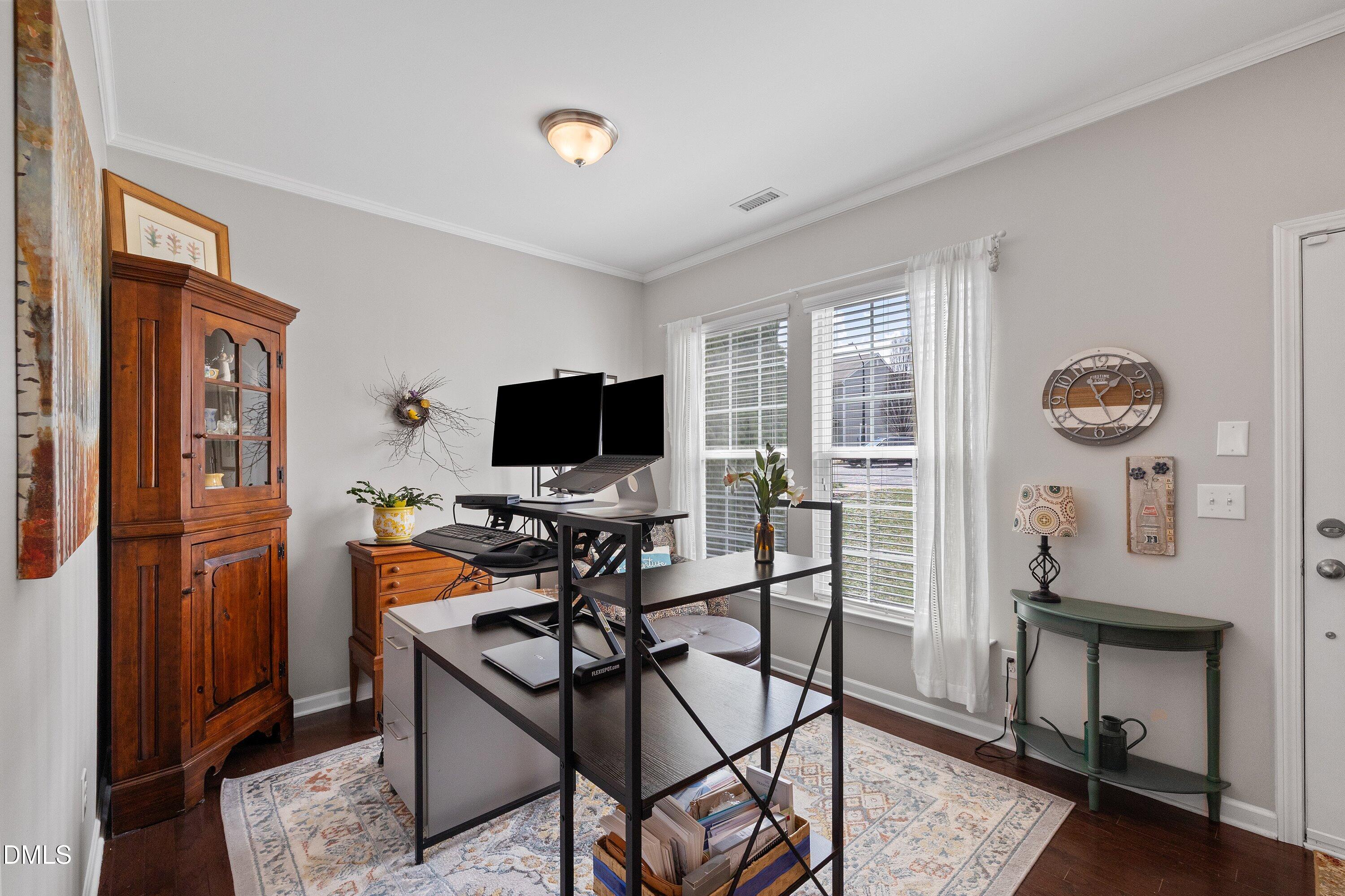 1093 Renewal Place Raleigh, NC 27603 - Photo 4 of 45 a view of a livingroom with furniture and a flat screen tv