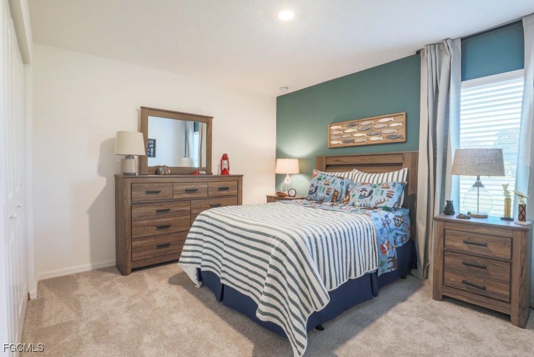 3505 32nd Street Southwest Lehigh Acres, FL 33976 - Photo 8 of 11 a bedroom with a bed and a dresser